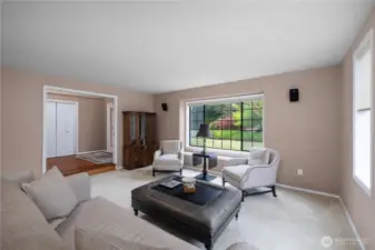 Large windows keep the formal living room light and bright.