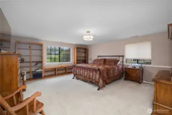 The primary suite is huge!  Built in shelves and large windows are a bonus!