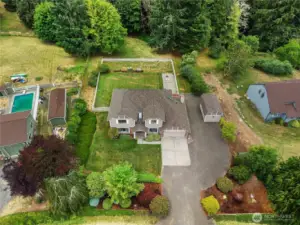 The property goes beyond the fence to the trees.
