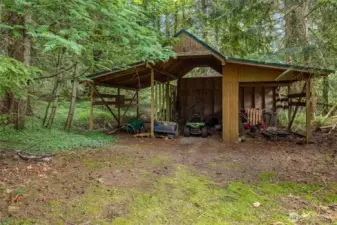 Outbuilding for riding lawn more and other yard tools.