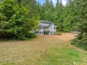 Beautiful, open space that is framed with wooded area.  Peace and tranquility just out the back door.