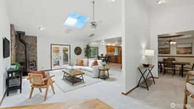 Upon entering this home you are greeted by an abundance of natural light & beautiful cathedral ceilings truly elevating this space.