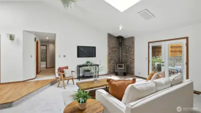 Abundant natural light pours in through the skylights, creating a bright and airy atmosphere.
