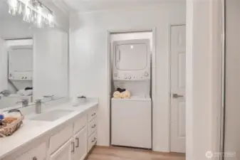 Bathroom with stacking Washer and Dryer in closet