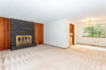 Living room, adjacent to dining room, overlooking rear garden area.