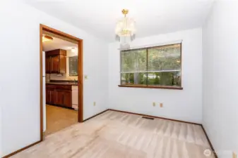 Dining room, adjacent to living room, the kitchen is to the left.