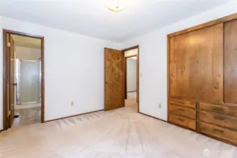 Lots of storage in primary bedroom, bathroom to left.