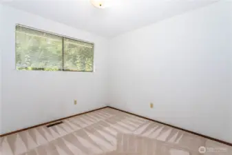 2nd bedroom, overlooking rear garden ara.
