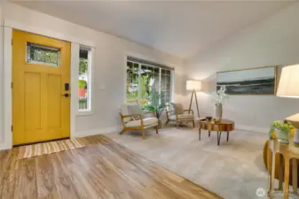 This cozy living area greets you with newer window, trim, flooring and more.  Great space for extended dining, entertaining, or home library.