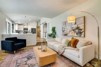 This generous family room is the perfect place to watch the game and enjoy the fire as you BBQ the wings on the patio.