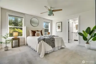 This sumptuous primary suite has so much space!  You'll love the private bath with heated tile floors, dual vanities, and walk in closet.