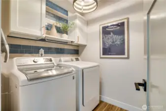 Swoon for this finished, adorable laundry room.