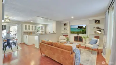 Step inside to an open-concept layout accented by warm, gleaming wood floors.