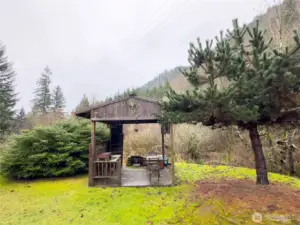 Shed with firepit overlooking Lake Creek