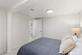 An alternate view highlights the room’s size and flexibility, easily accommodating use as a home office, media room, art studio, workshop, or guest space.