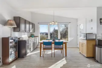 Spacious dining room with additional built in kitchen cabinets.