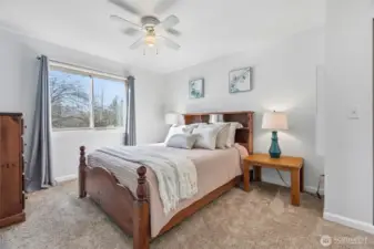 Primary Bedroom with en-suite 3/4 bath. South facing window lets in plenty of sunshine.