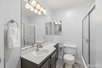 Full Bath features a linen closet and a tankless hot water heater.