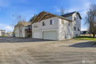 Private 2 car garage is the one on the far right. One additional assigned uncovered parking space is included for a total of 3 designated parking spaces for this unit.