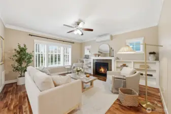 The living room has a gas fireplace and mini-split, offering comfort year round.