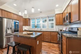 The kitchen has all stainless steel appliances.