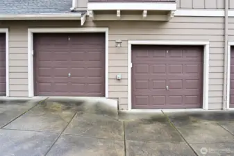 Two garage bays for parking and storage located behind the house.