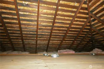 Attic includes finished flooring and offers exceptional storage space.