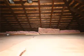 Attic includes finished flooring and offers exceptional storage space.