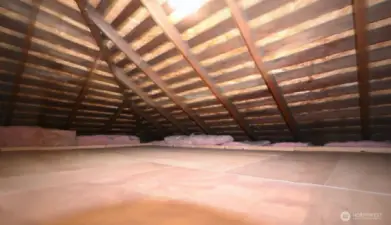 Attic includes finished flooring and offers exceptional storage space.