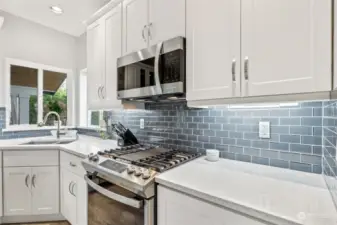 Main bath freshened up with new cabinets, countertops, fixtures, trim, paint.  Tile floors are original but nice condition.  composite shower and jetted tub.