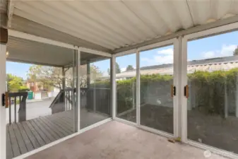 Sunroom with slider doors on all sides.