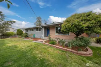 Step into the Burien rambler lifestyle—fully turnkey inside, with outdoor space ready for your green thumb to shine.