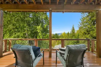 Covered deck on first lower level with view of the lake