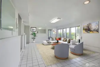 2nd seating area/ family room that can EASILY TURNED INTO A KITCHEN  to accompany the 1 bedroom and  2 bathrooms already downstairs.