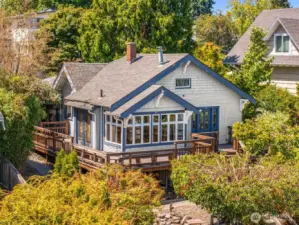 French doors lead to the wrap around porch for effortless indoor-outdoor living.