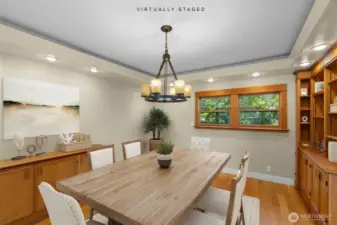 Dining room with beautiful built-in cabinets. This image has been virtually staged.