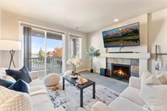 Light and bright main living space with cozy gas fireplace.