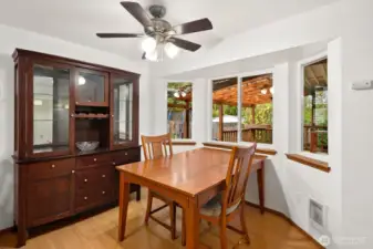 Dining room with windows to backyard.