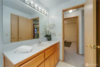 Soft Blue and well lit, this Full bath is adjoined to your Primary Suite!