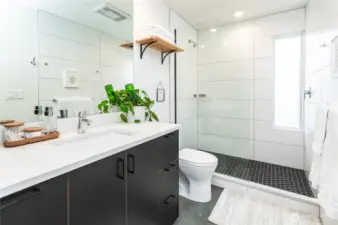 Large custom tiled shower for relaxing showers.