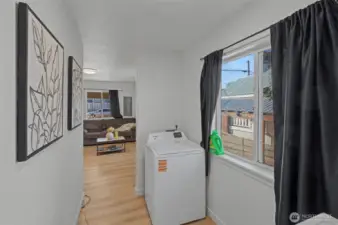 Unit A washer/Dryer area looking to living room