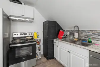 Unit C (hotwater tank behind screen)