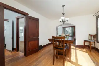 Hall to the left accesses the two bedroooms, bathroom and door to the unfinished baement.