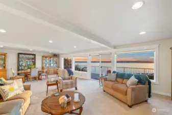 Easily flow from the waterside dining room to  the spacious living room adjacent.