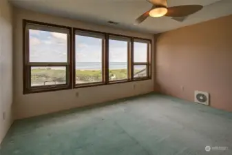 Wake up to the stunning sunrises and water views every morning in the primary  bedroom!