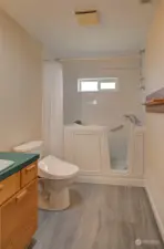 Walk in bathtub/shower in upstairs bath.