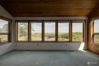 Living room looks out to the estuary and Bay.