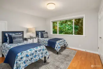 Bedroom number three overlooks the greenbelt with two large closets.