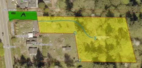 If making a site visit, park on the north side of Tract A. Follow the cleared path (blue line) up slope toward building site marked by blue X. Get your bearings by keeping track of the cyclone fence and their two corners.