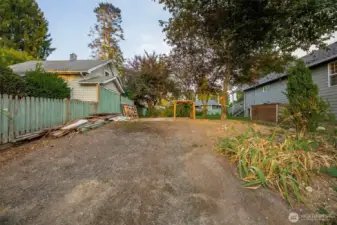 Paved access to concrete pad in back yard.